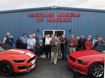 Greater Odenville Chamber of Commerce, City of Odenville, St. Clair County EDC along with Powells cut ribbon to celebrate Mustang Museum of America grand opening